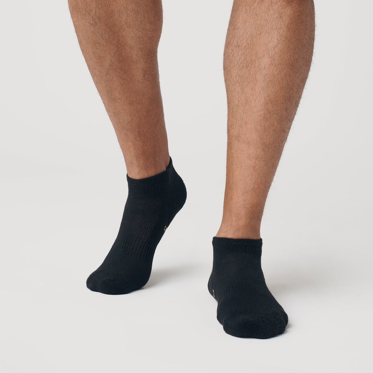 Black Ankle Socks Single on feet, showcasing seamless toe and contour seam.