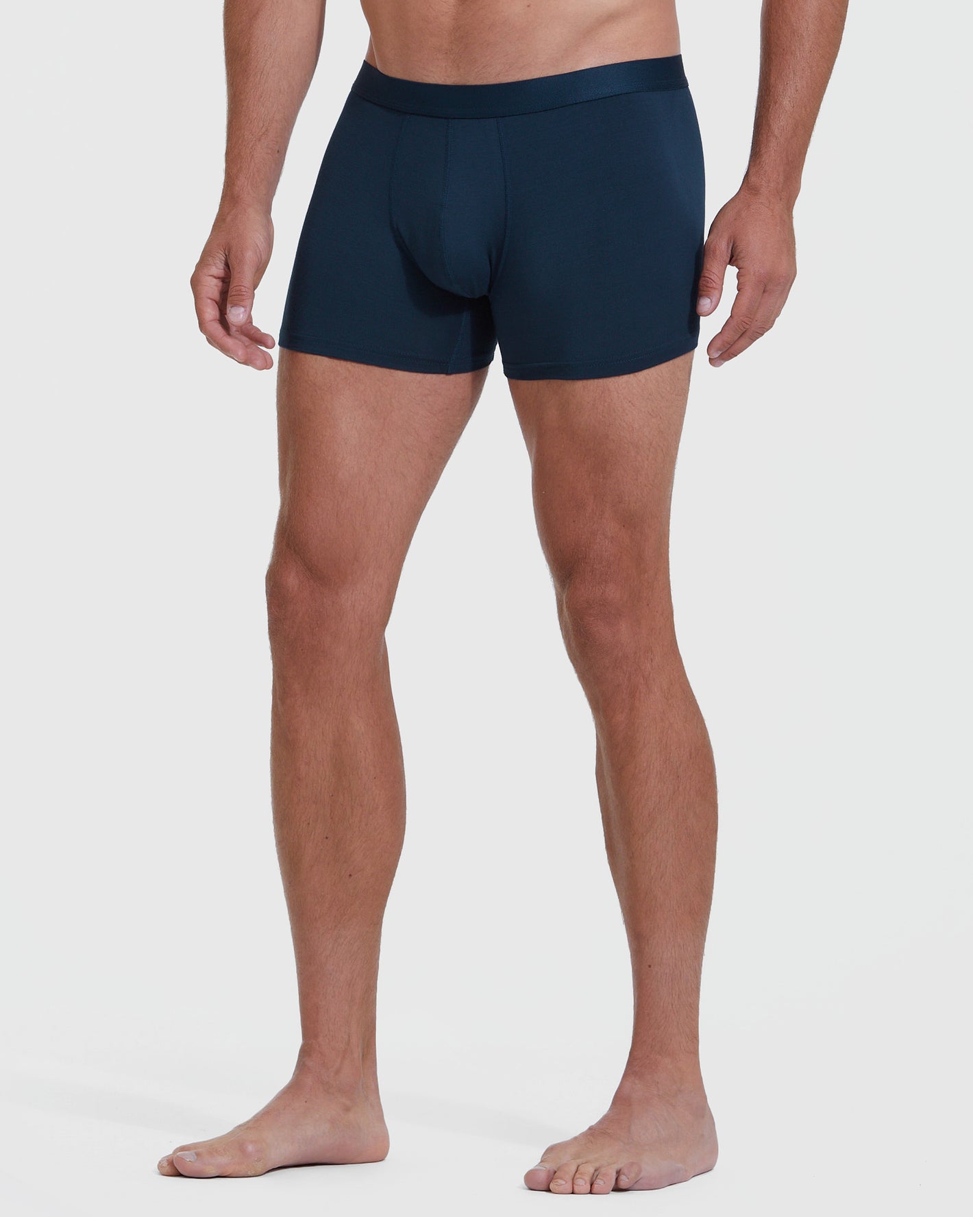 Navy Boxer Trunk modeled on standing figure.