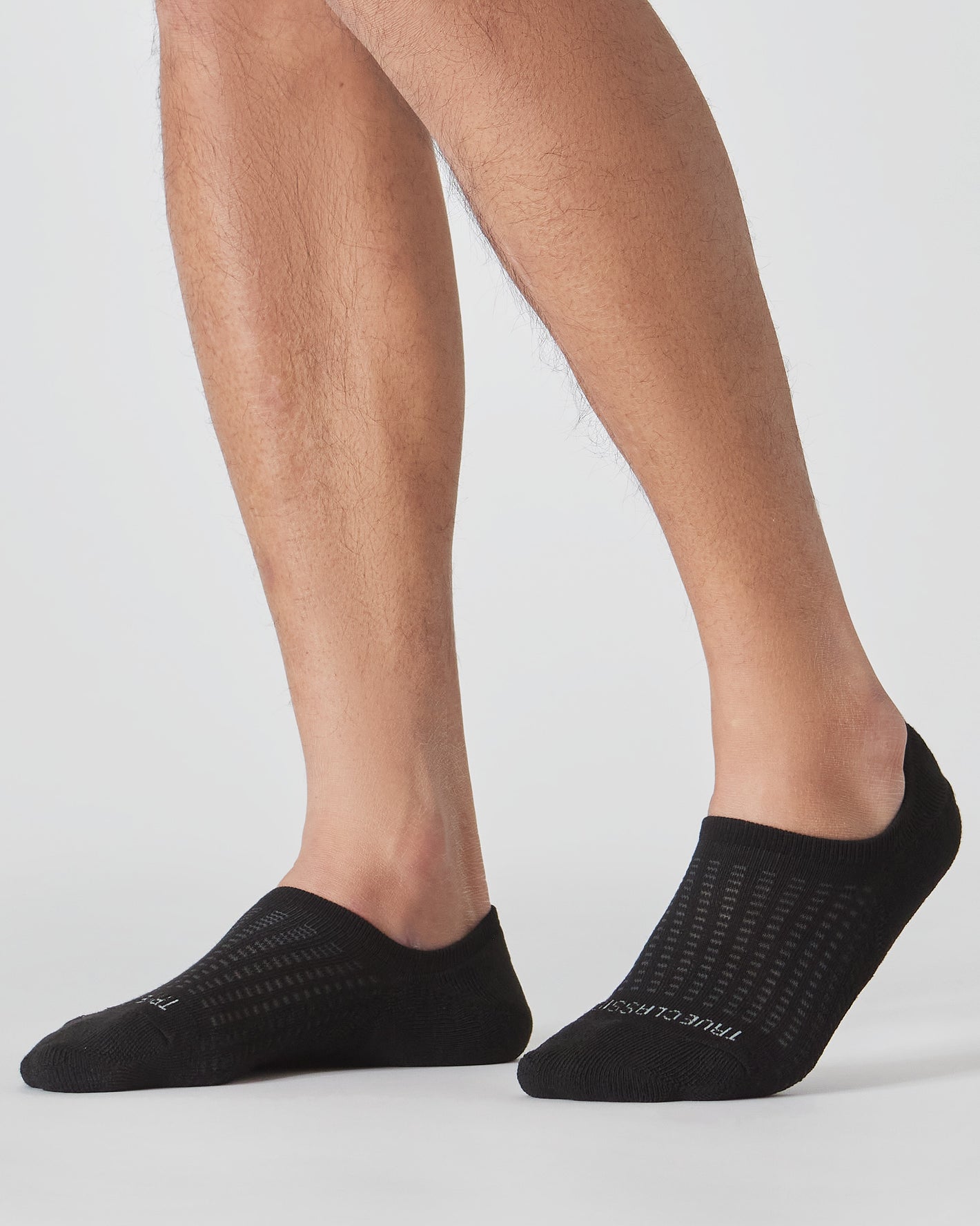 Combo Active No Show Socks 3-Pack on male feet, showcasing fit and design.