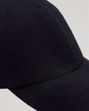 Black Active Running Cap with breathable fabric and adjustable closure.