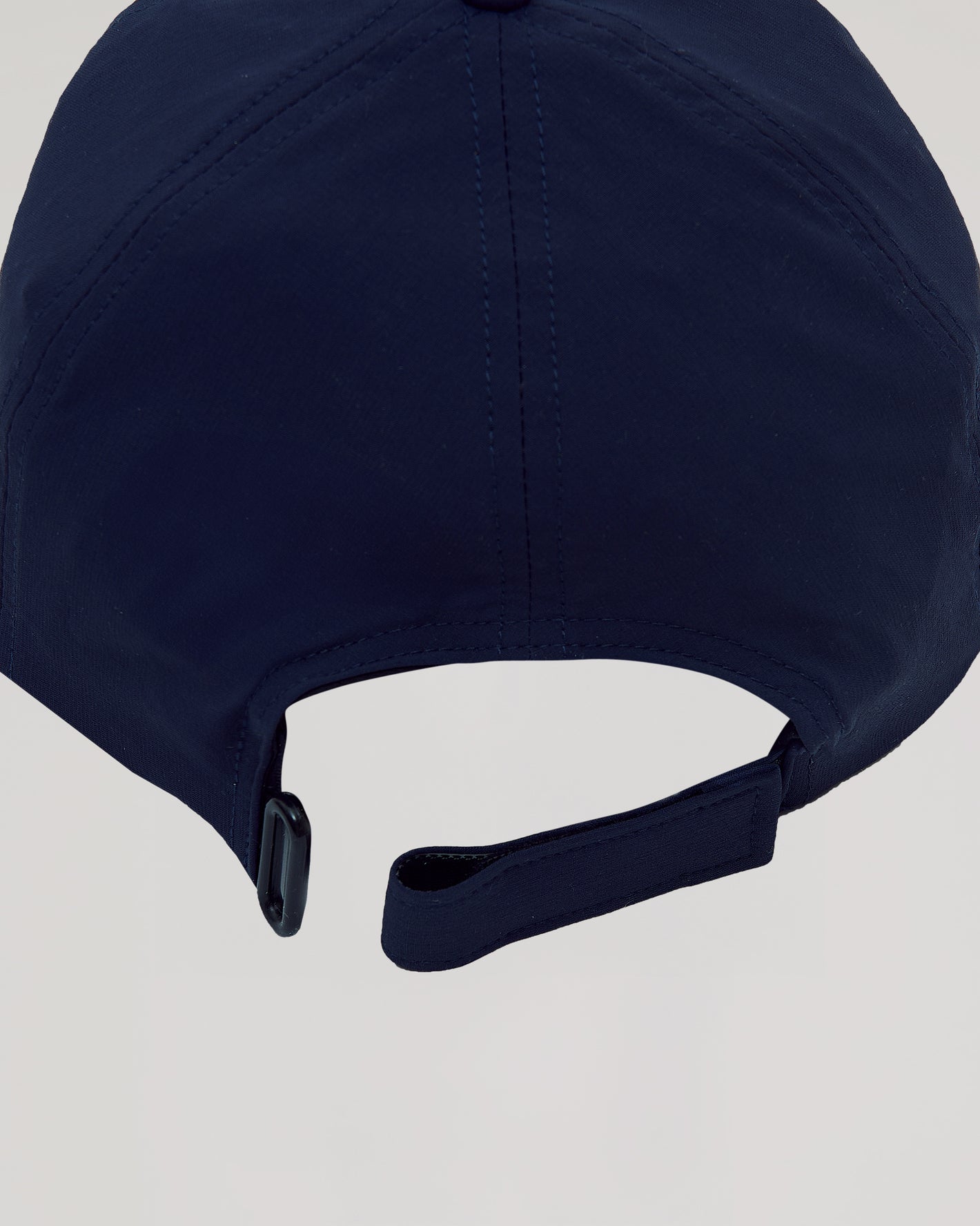 Navy Active Running Cap's adjustable strap with buckle detail.