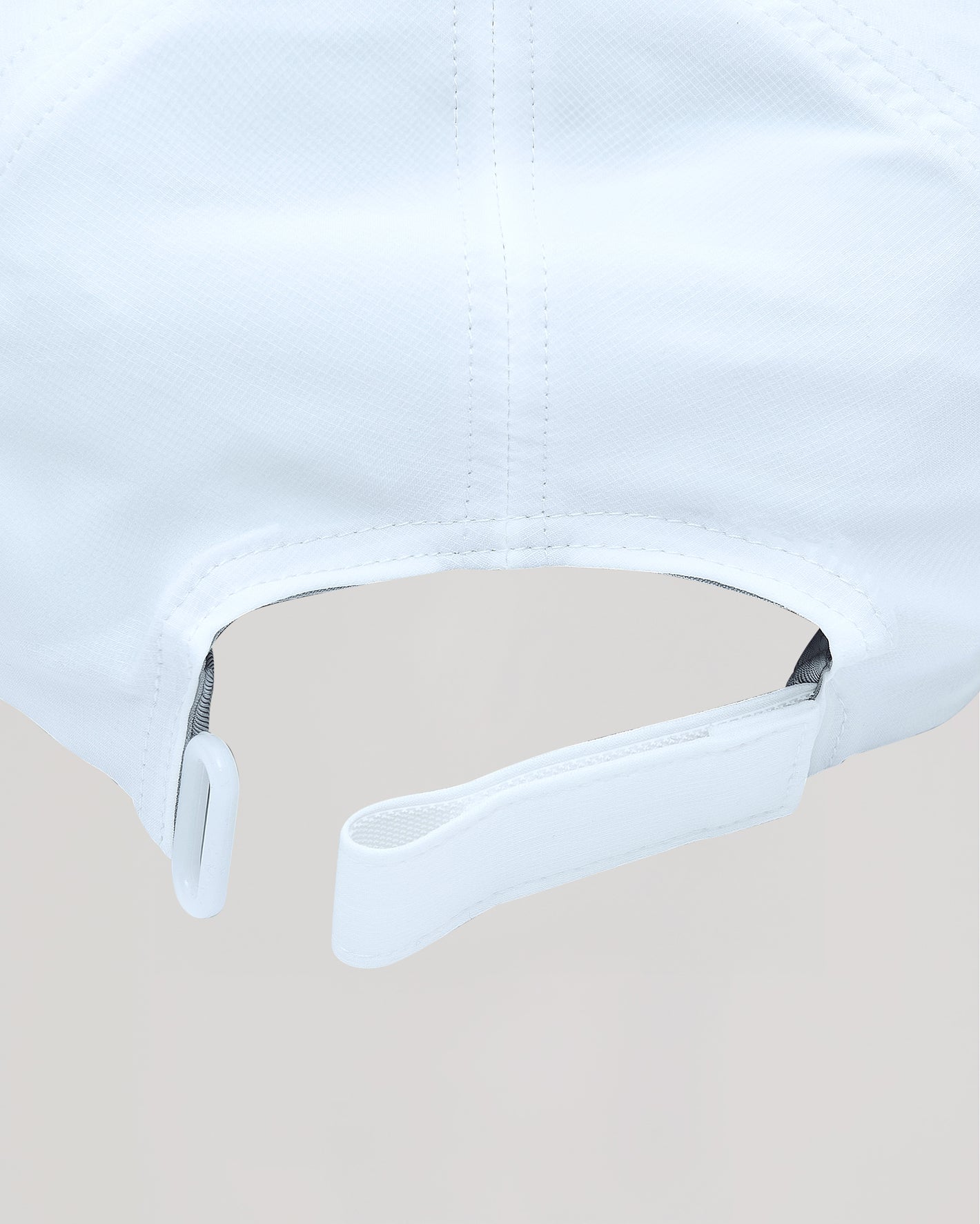 White Active Running Cap with adjustable strap and breathable, lightweight design.