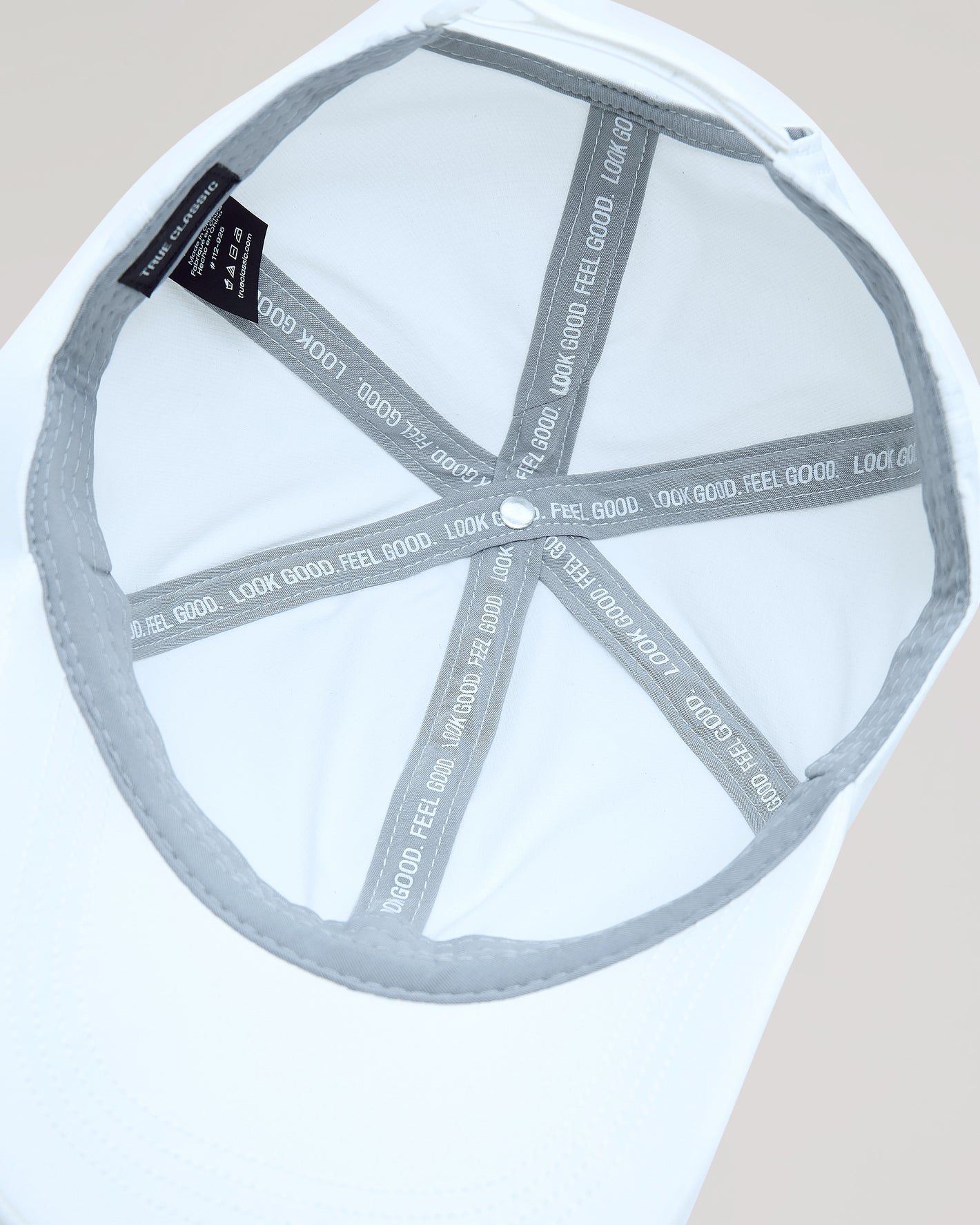 Inside view of White Active Running Cap showing six-panel construction and motivational tape.