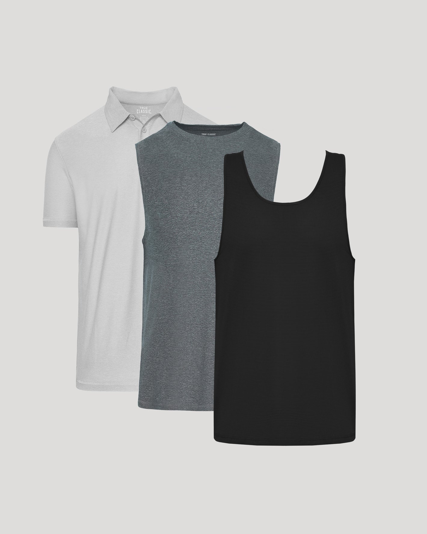 Three shirts in gray, black, and white on a light gray background
