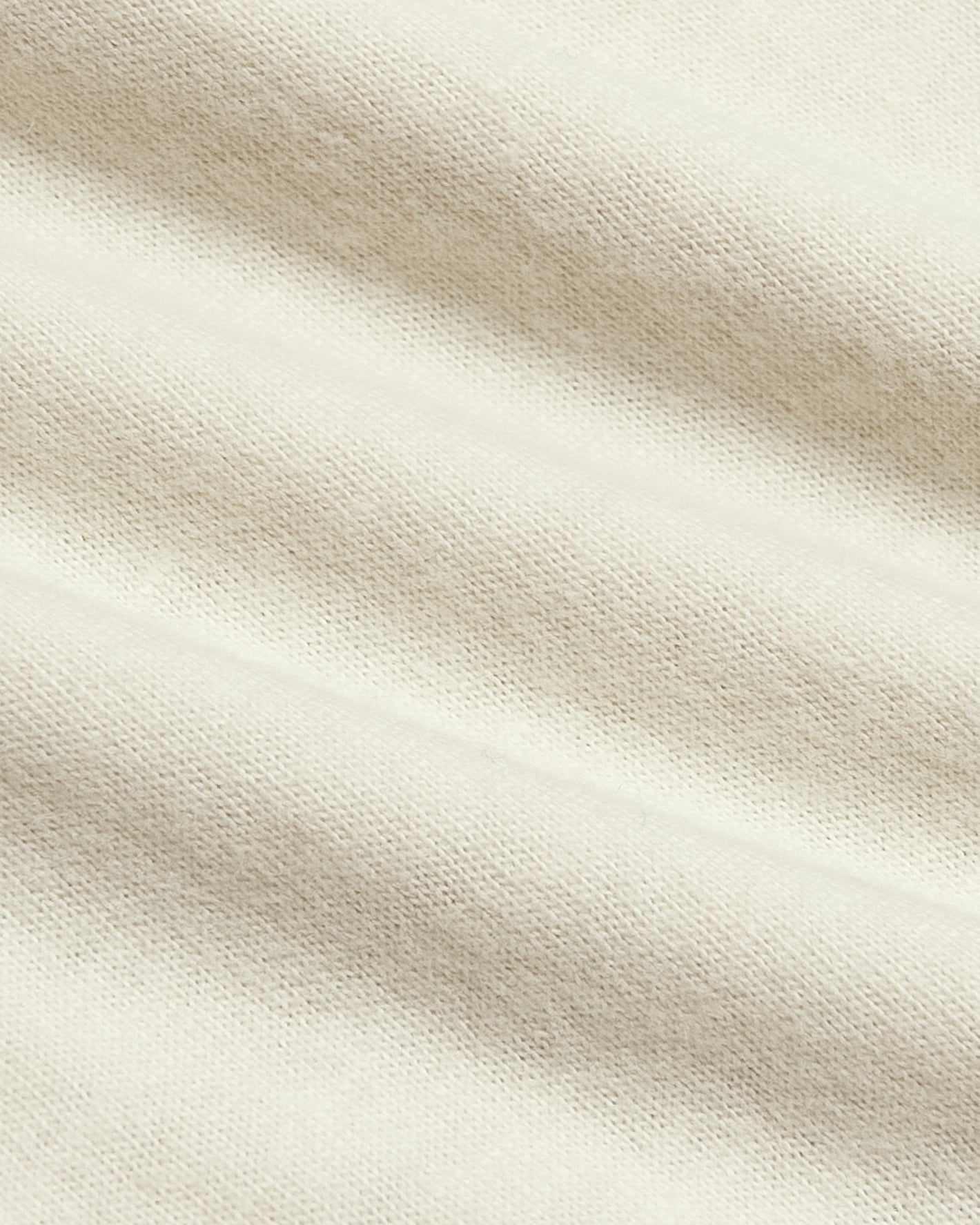 Alabaster Classic Crew Neck in light-beige knit fabric close-up.