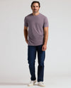 Man wearing Dark Heather Amethyst Classic Crew Neck and dark jeans.