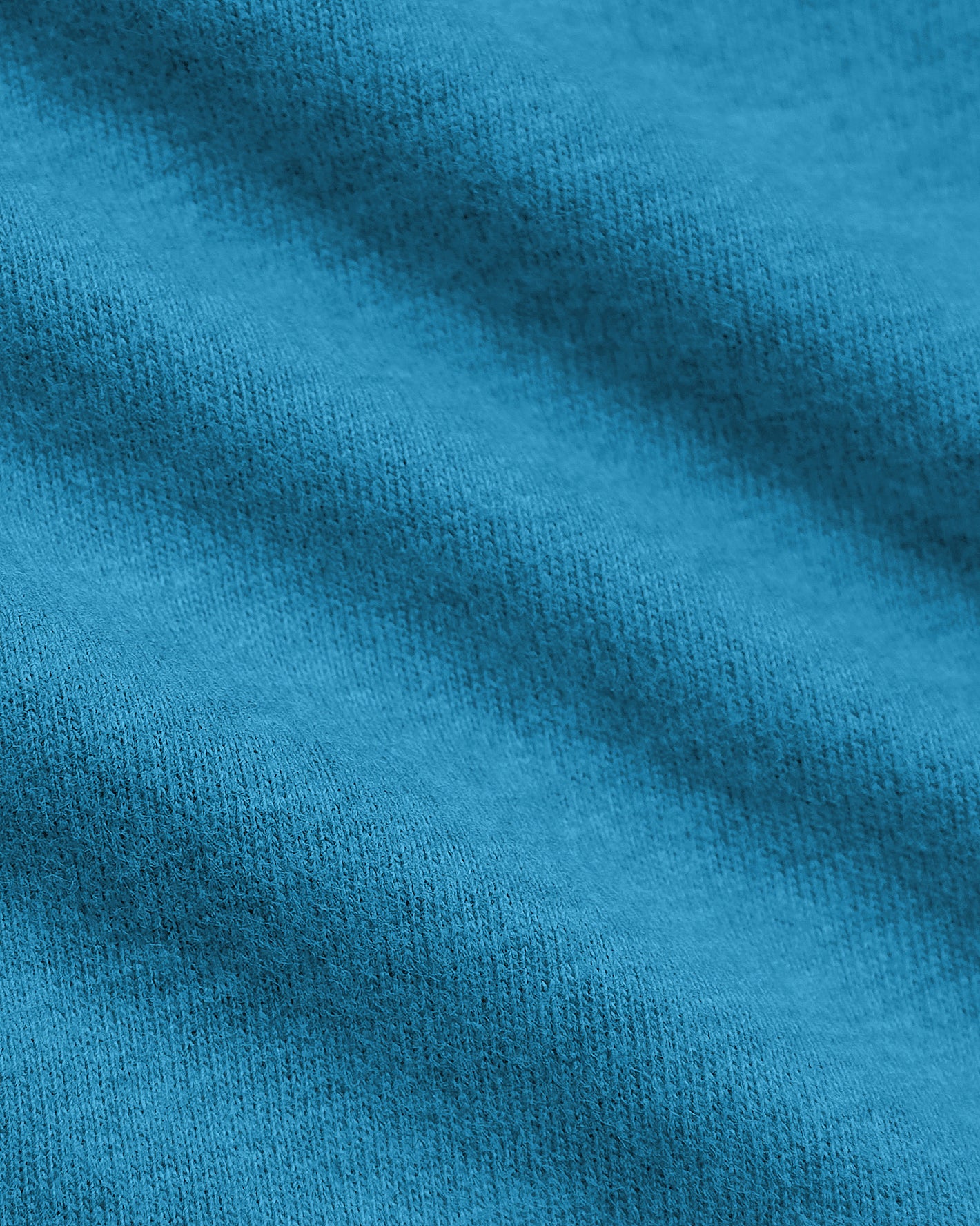 Dark Heather Bahama Blue Classic Crew Neck fabric close-up, showcasing knit loops.