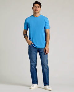 True ClassicDark Heather Bahama Blue Classic Crew Neck on young man in studio setting.
