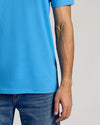 Dark Heather Bahama Blue Classic Crew Neck with blue jeans waistband visible.