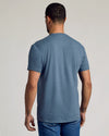 Back view of man in Dark Heather Tempest Classic Crew Neck t-shirt.