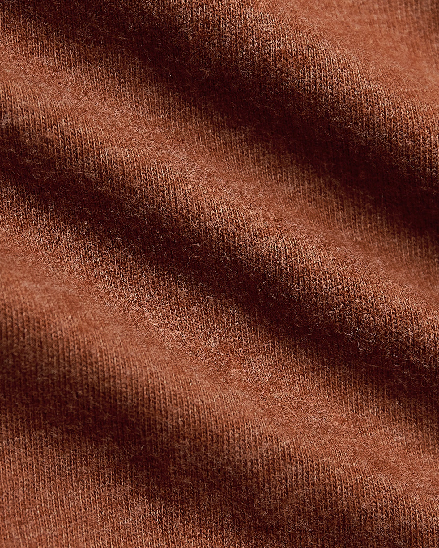 Heather Gingersnap Classic Crew Neck, showcasing fine knit texture and folds.