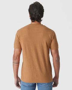 True ClassicGolden Mane Classic Crew T-shirt, back view, with tattooed forearm visible.