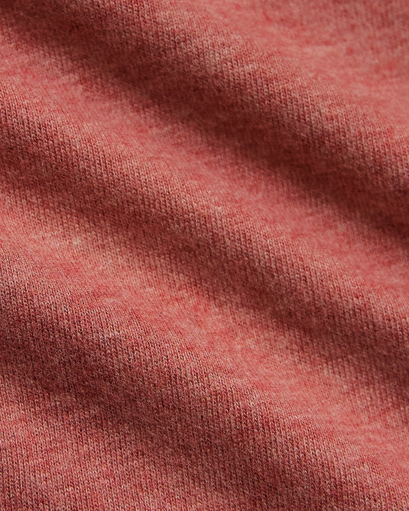 Light Heather Vermilion Classic Crew Neck showcasing soft, textured knit fabric.