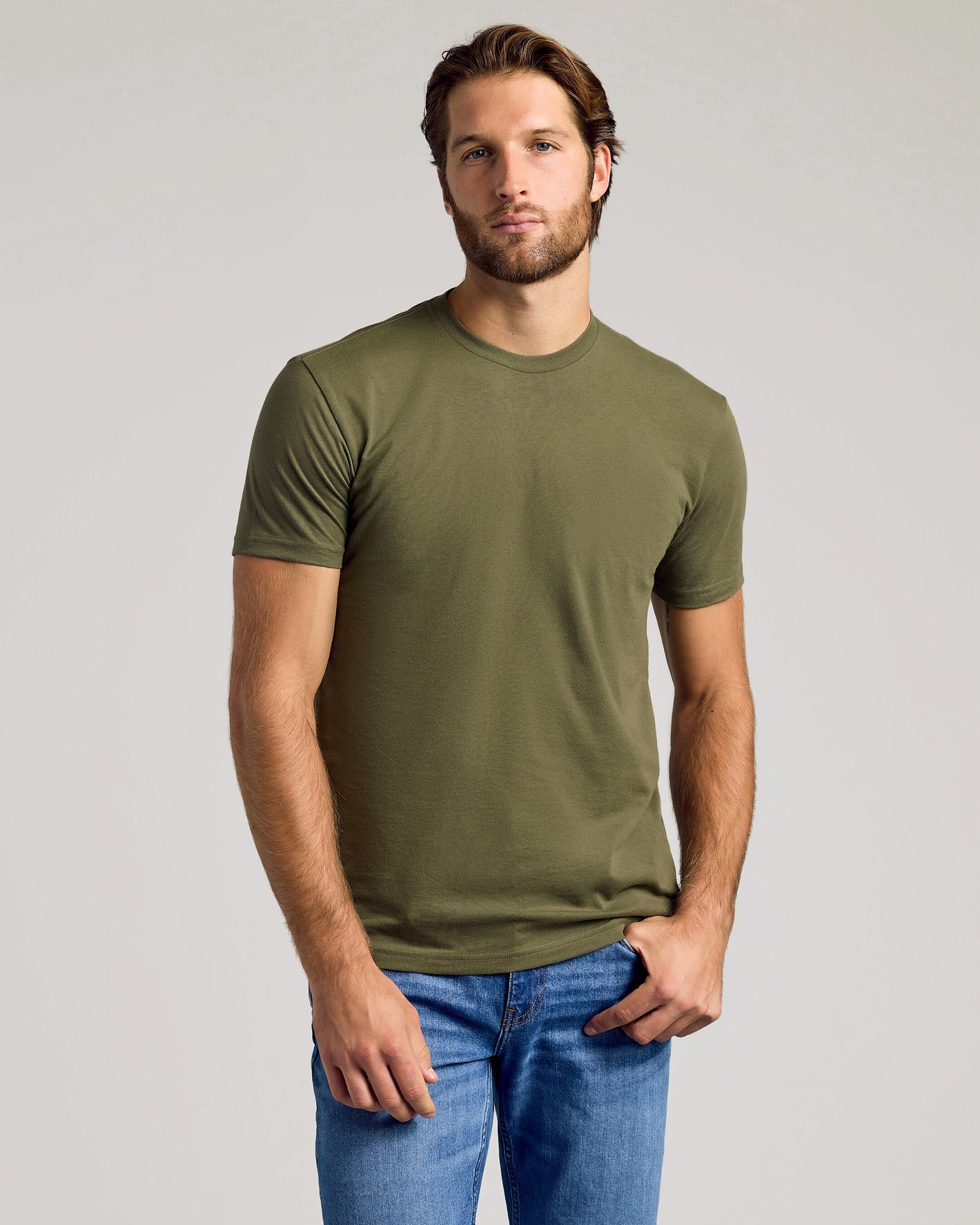 Young man in olive-green tee from The Versatile Crew 9-Pack.