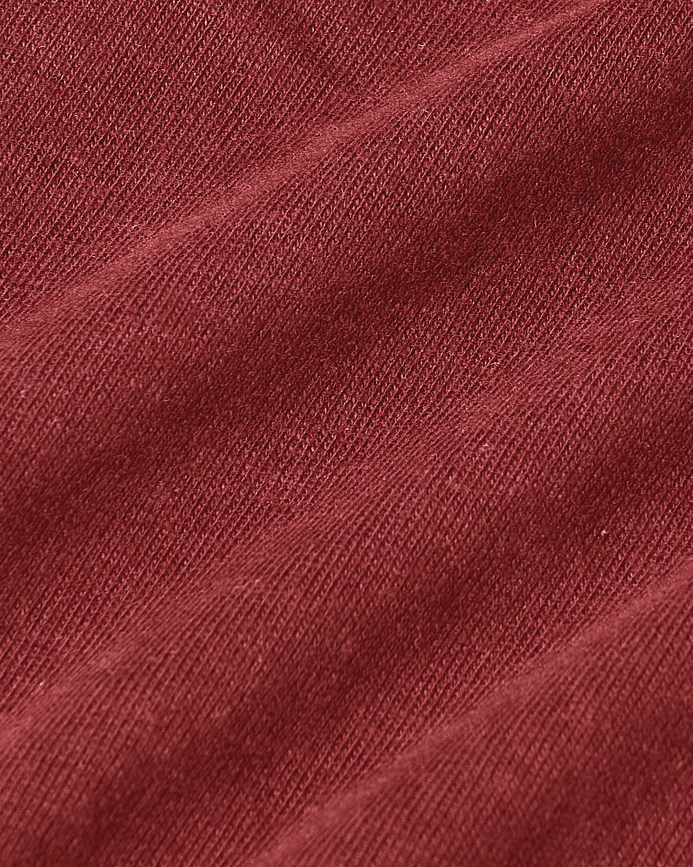 Rustic Apple Short Sleeve Crew Neck, close-up of textured red knit fabric.
