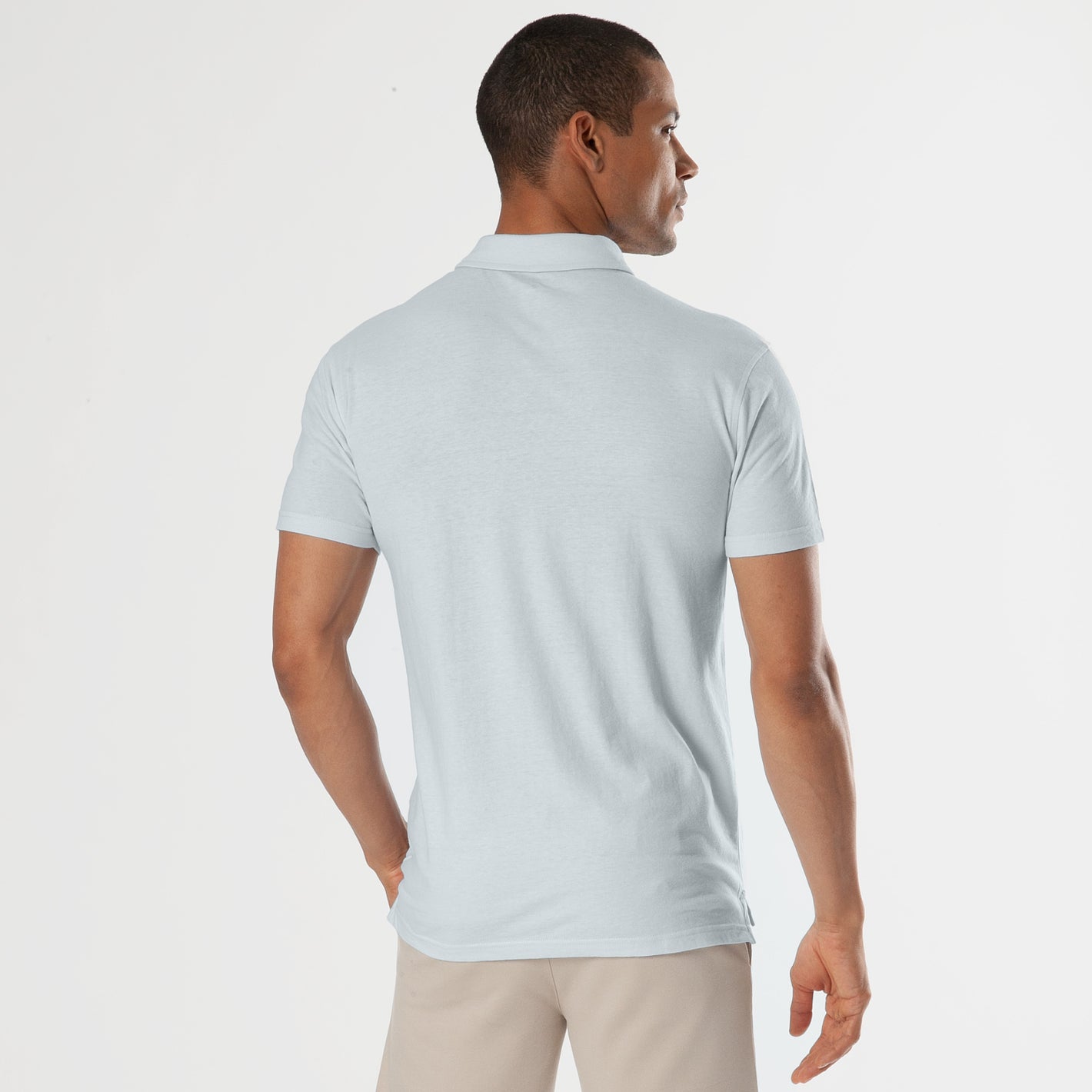 Blue Quartz Short Sleeve Polo, back view, worn by a man.