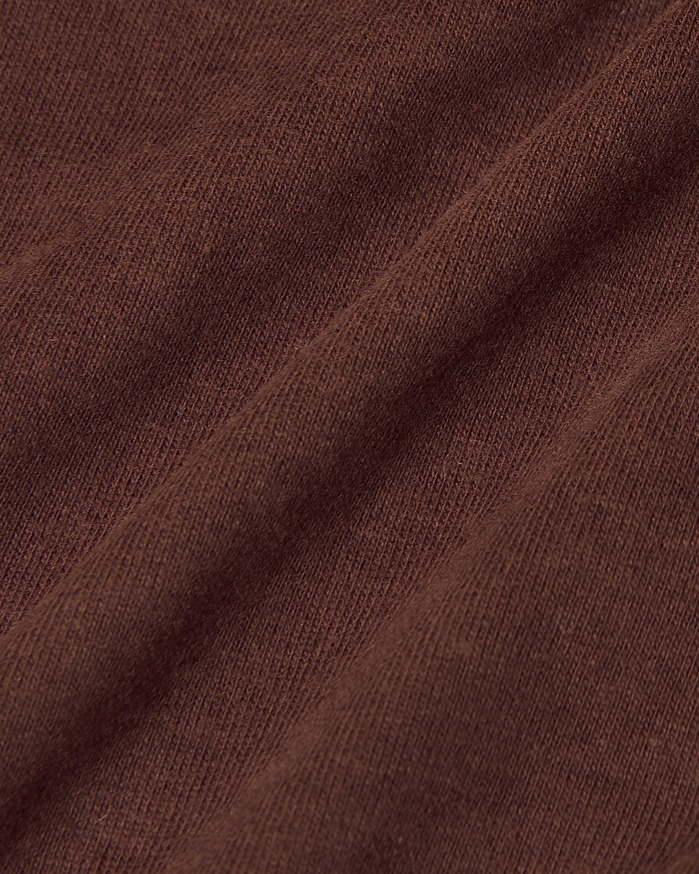Dark Chocolate Short Sleeve Polo's fine knit fabric details.
