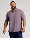 Man smiling in Dark Heather Amethyst Short Sleeve Polo, showcasing fit.