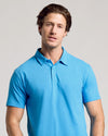 Young man in Dark Heather Bahama Blue Short Sleeve Polo.