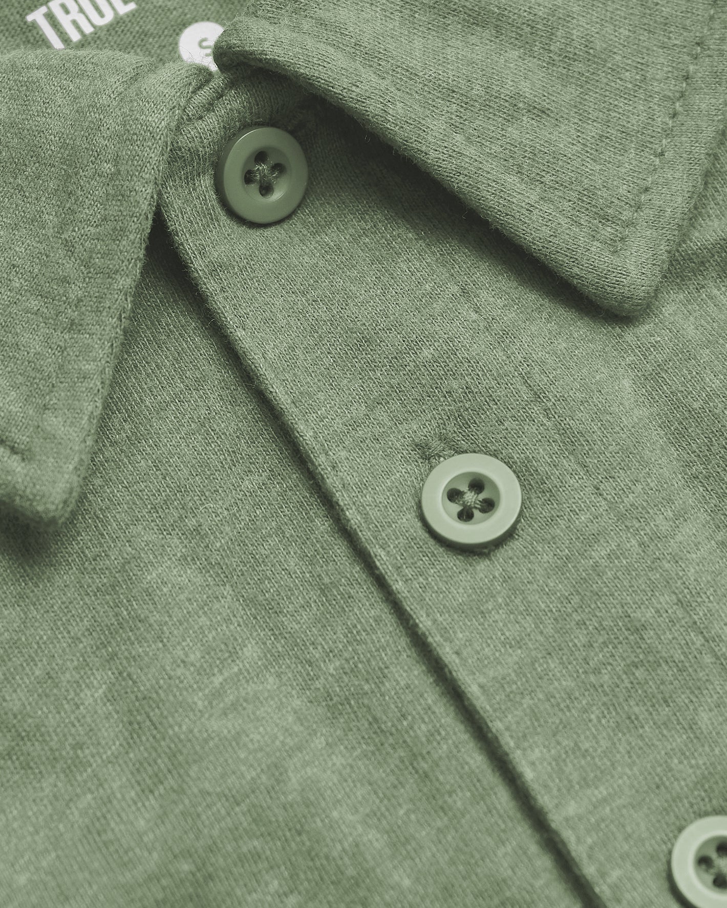 Dark Heather Bay Green Classic Polo with two-button placket and folded collar.