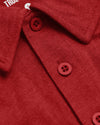 Dark Heather Lava Short Sleeve Polo, red knit, folded collar, two buttons.