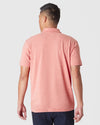 Back view of Heather Cayenne Classic Polo on person with tattooed forearm.
