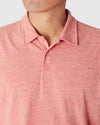 Heather Cayenne Classic Polo with collar and three-button placket.