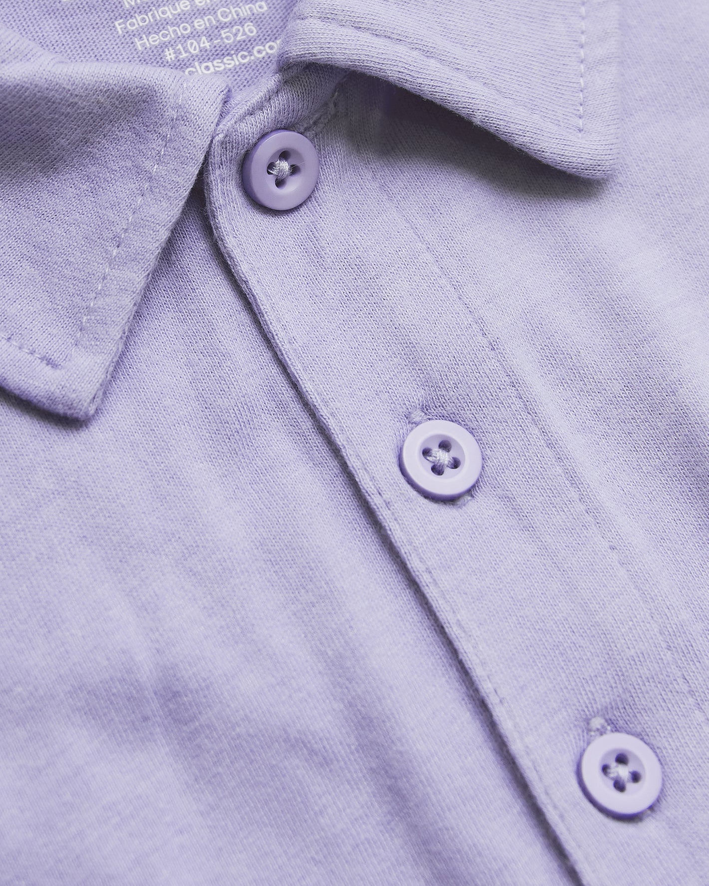 Heather Dark Orchid Short Sleeve Polo close-up showing collar and button placket.