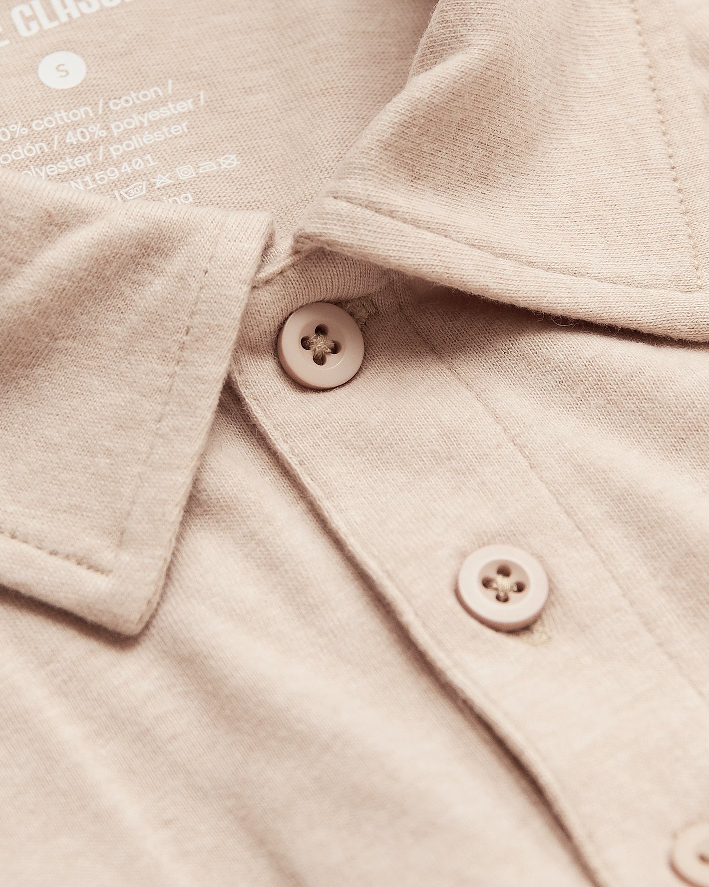Light Camel Cream Heather Polo, close-up of collar and buttons.