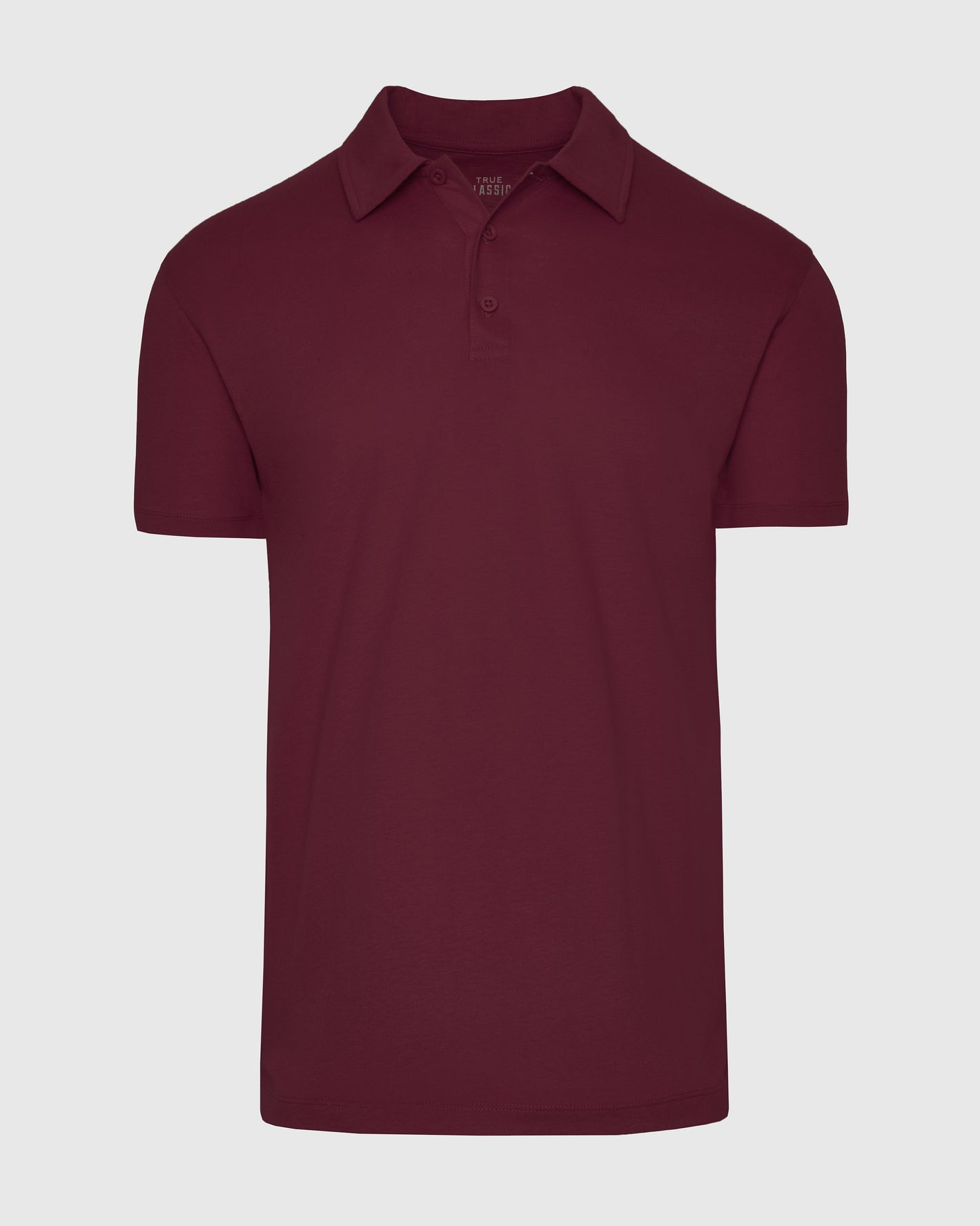 Mahogany Polo in deep burgundy, laid flat, short-sleeve design.