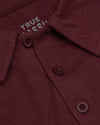 Mahogany Polo with knit texture and three-button placket.