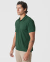 Man wearing Moss Green Polo and light khaki pants.