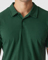 Moss Green Polo with short sleeves and two-button collar.