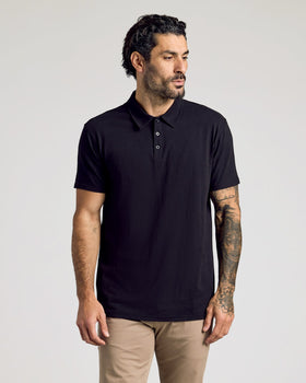 Man wearing Classic Polo 6-Pack in black and light-tan chinos.