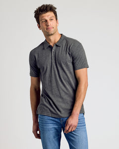 True ClassicMan wearing Heather Polo 3-Pack in charcoal-gray with blue jeans.