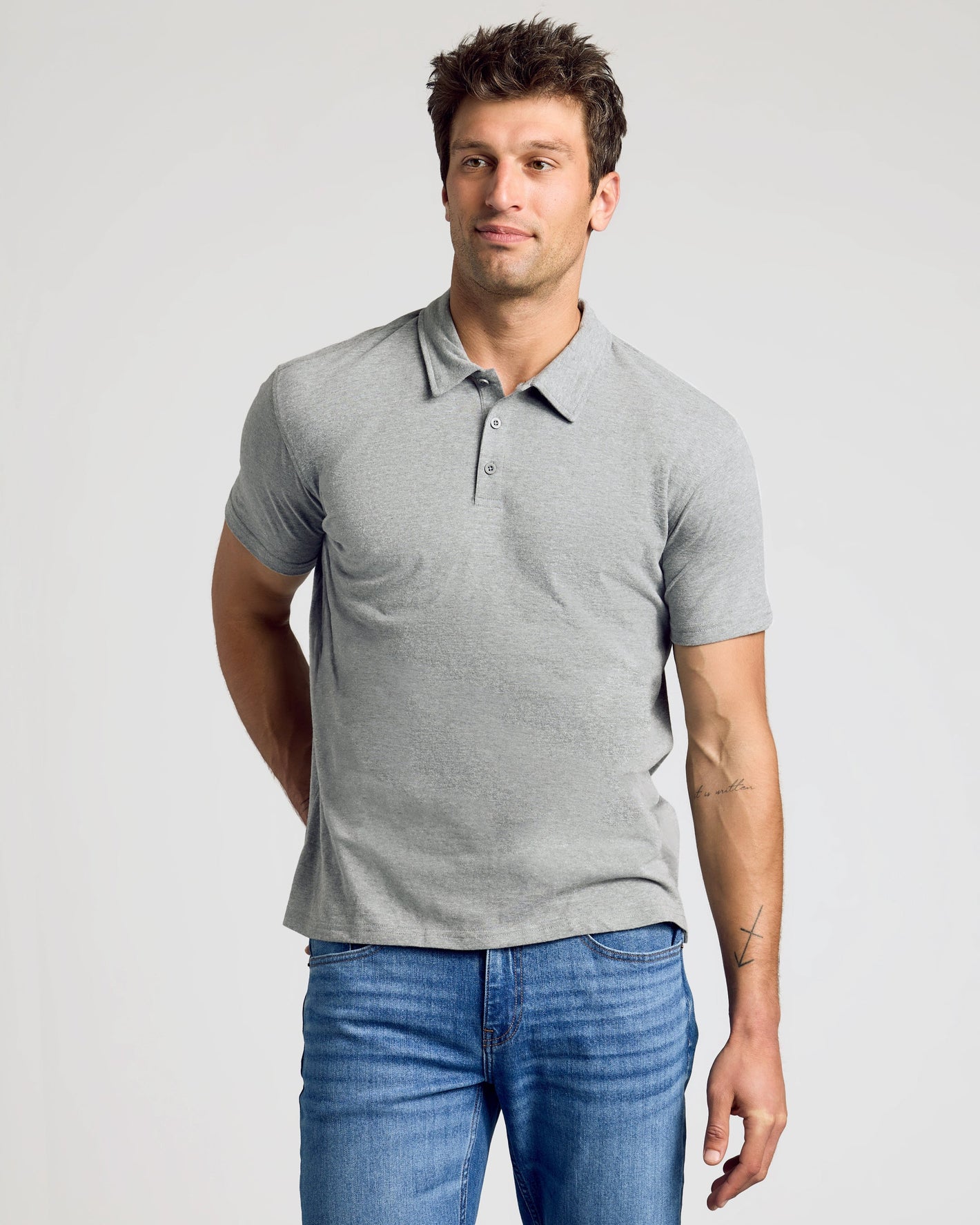 Man wearing Heather Polo from 3-Pack, showcasing fit and style.