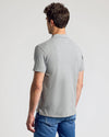 Heather Polo 3-Pack: Back view of person in heather-gray polo.