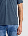 Wardrobe Classic Polo 10-Pack showcased on person in slate-blue T-shirt.