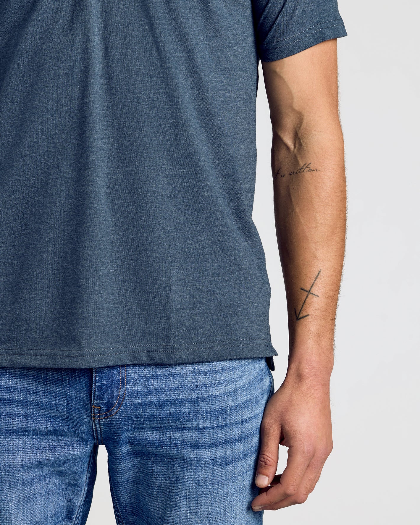 Wardrobe Classic Polo 10-Pack showcased on person in slate-blue T-shirt.