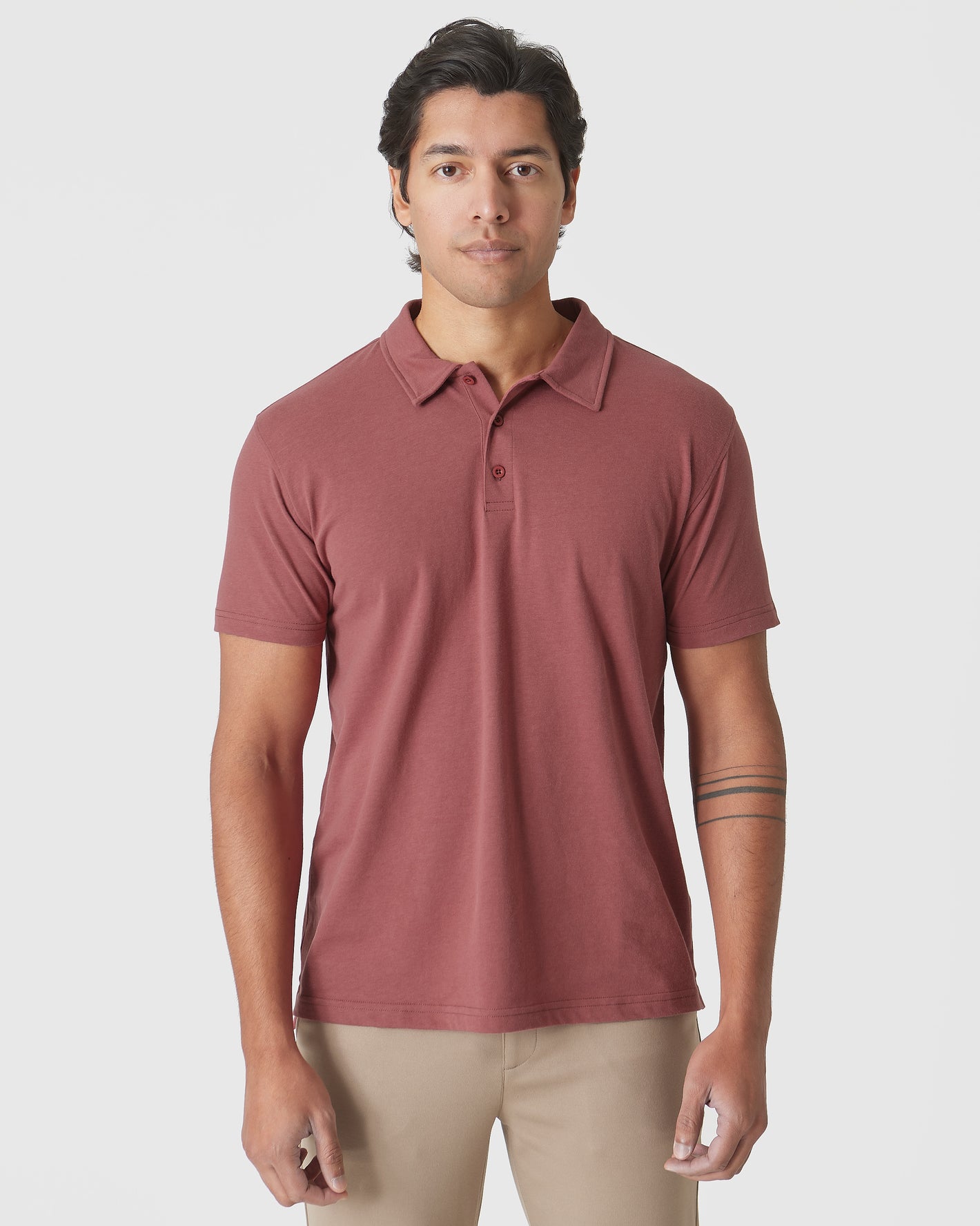 Rustic Apple Polo worn with light khaki pants.