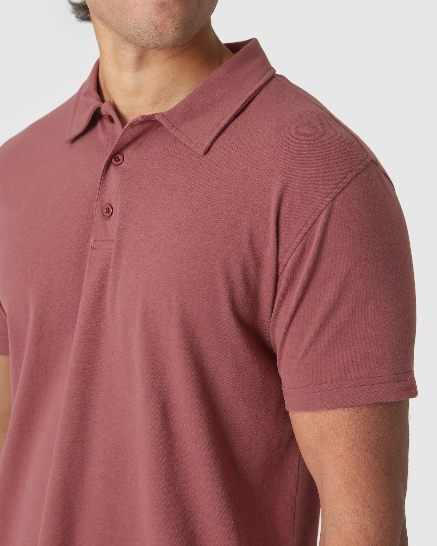 Rustic Apple Polo in muted rose, close-up of collar and fabric.