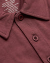 Rustic Apple Polo with folded collar and two-button placket.