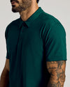 Man wearing Viridian Classic Polo, dark green, short-sleeve, three-button placket.