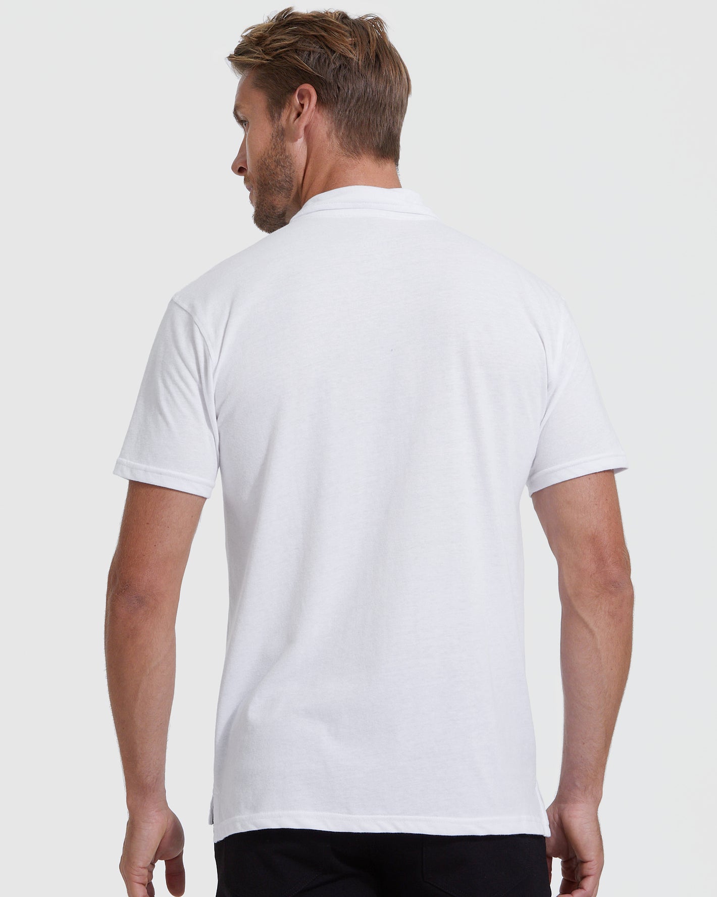 White Classic Polo 6-Pack, back view on model, relaxed fit.