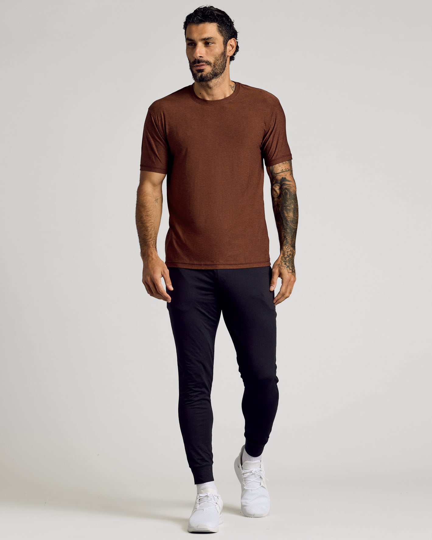 Cedar Active Short Sleeve Crew Neck Tee worn by a tattooed man.