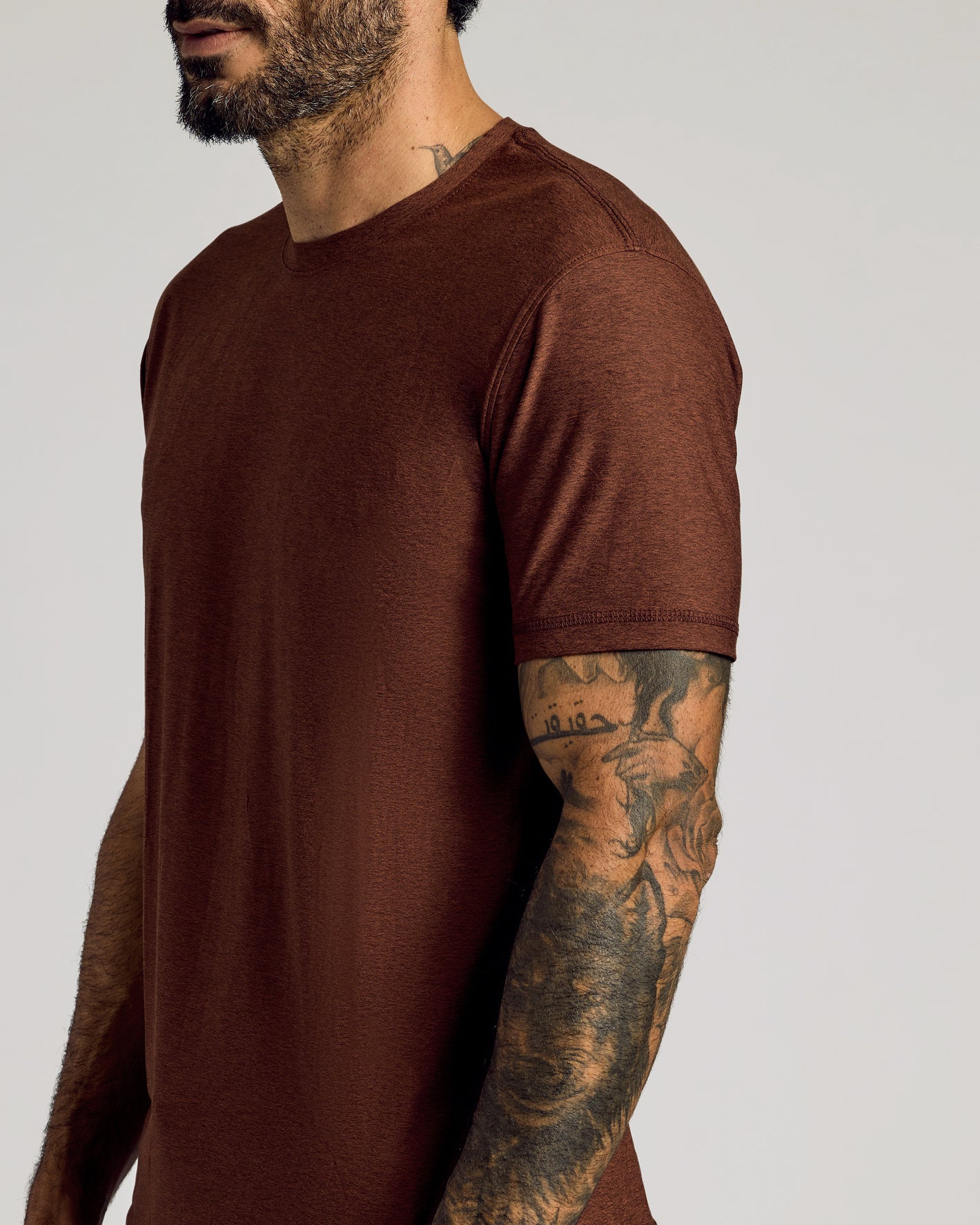 Cedar Active Short Sleeve Crew Neck Tee on tattooed arm.