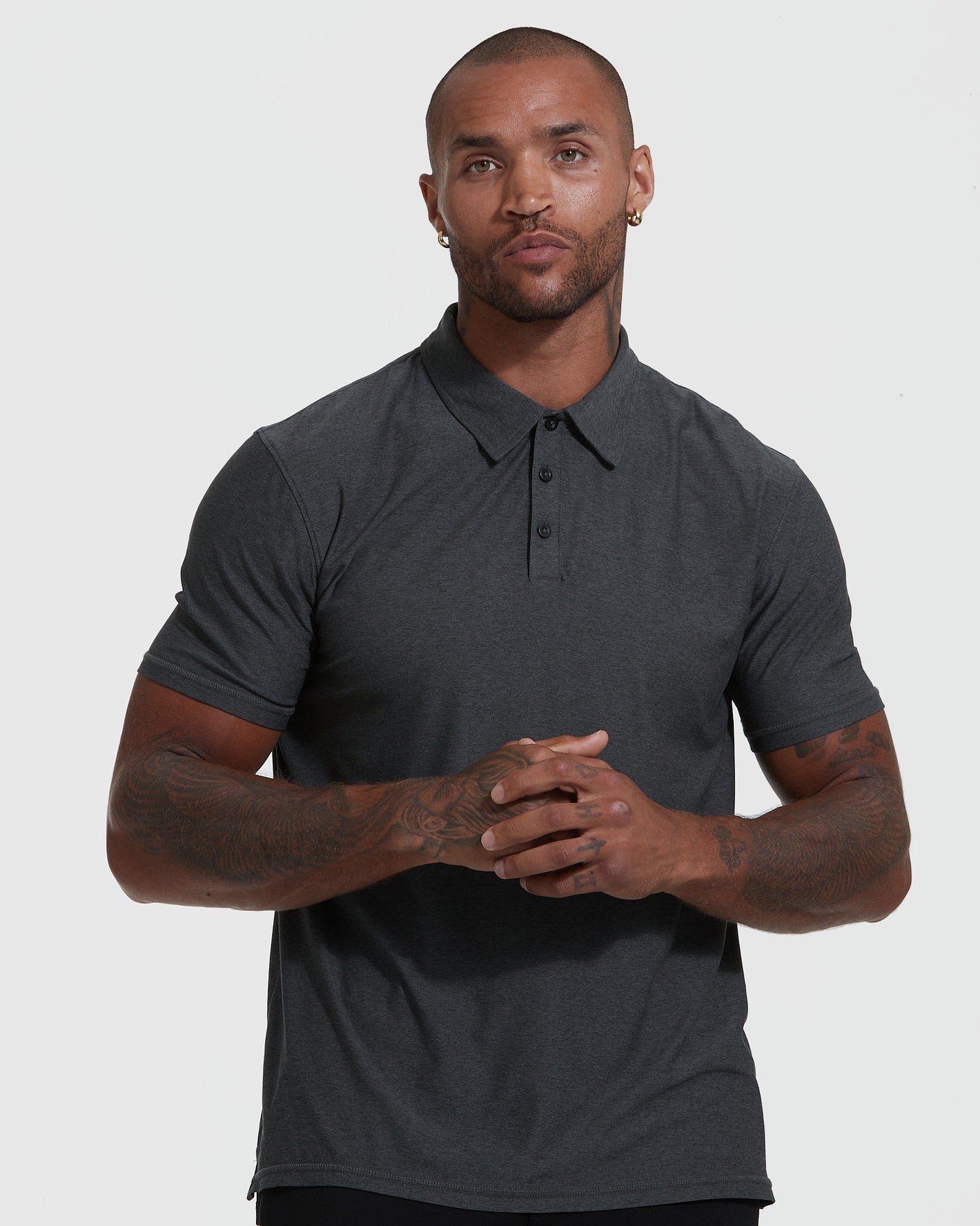 Man wearing True Classic Men’s Active Short Sleeve Polo, showcasing its modern fit.