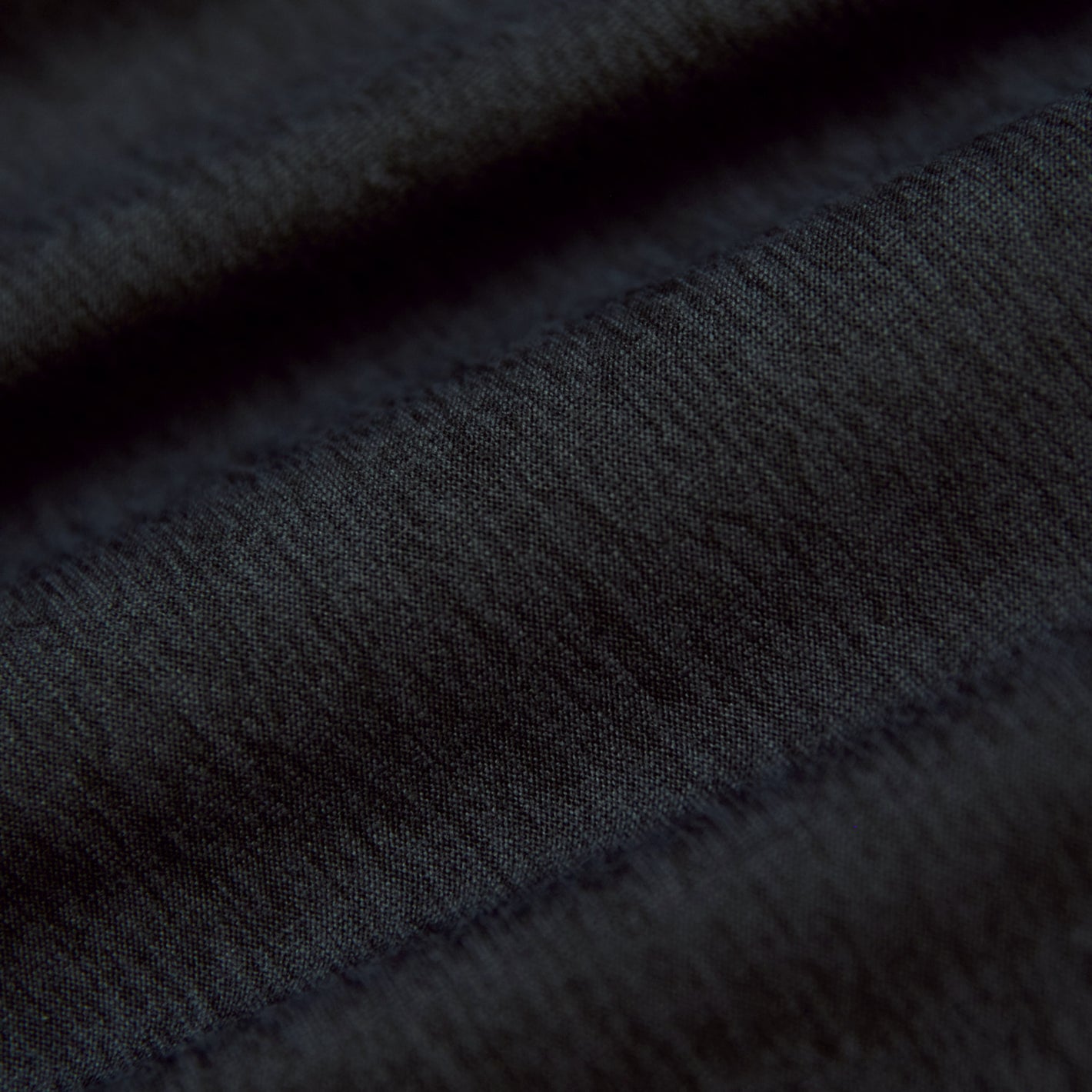 Charcoal Heather Gray Active Polo 2.0 fabric close-up, showcasing weave details.