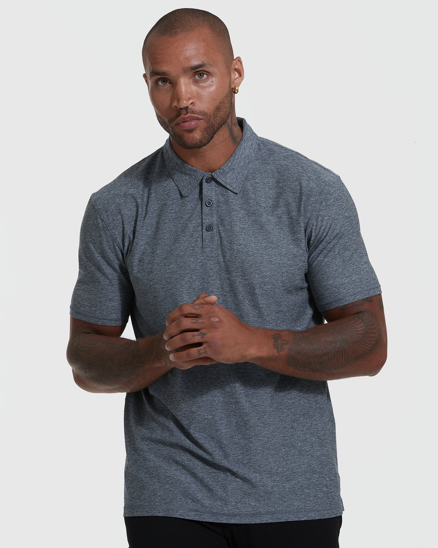 Male model in True Classic Men's Active Short Sleeve Polo.