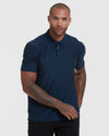 Model wearing True Classic Men's Active Short Sleeve Polo with tattoos visible.